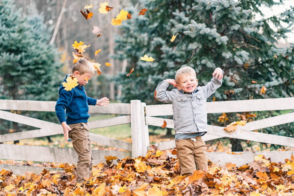 woodstock vermont family photo session: boys playing in leaves