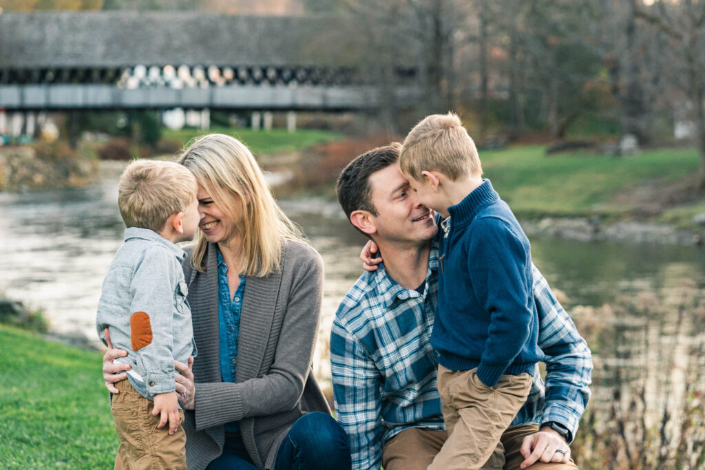 woodstock vermont family photo session: candid photo of parents goofing with kids