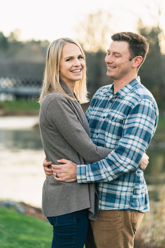 woodstock vermont family photo session: parents together in front of covered bridge