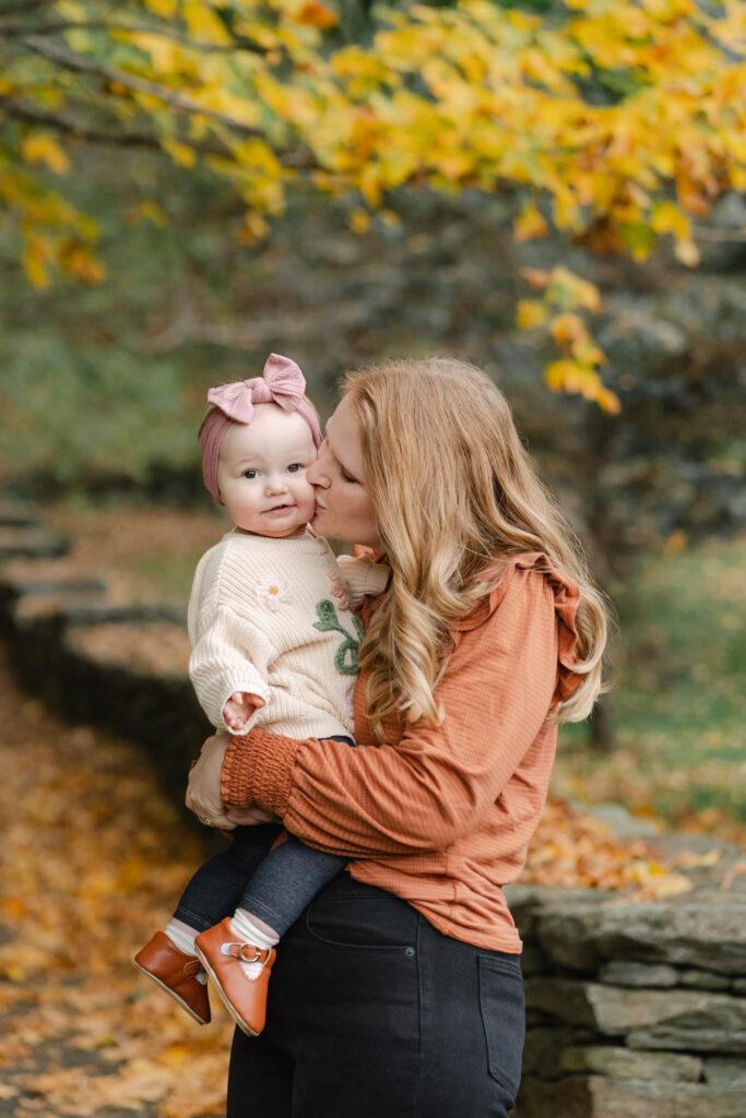 mother kissing baby's cheek woodstock vermont fall family photo session