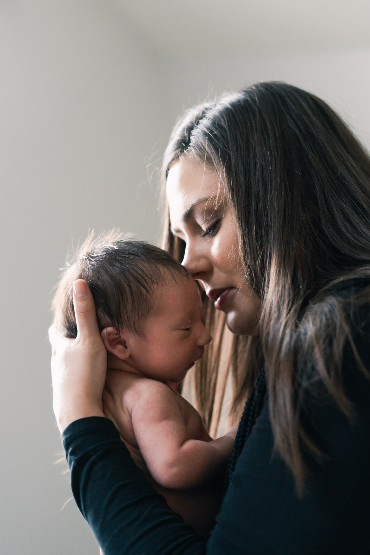 artful image of mother sniggling with son