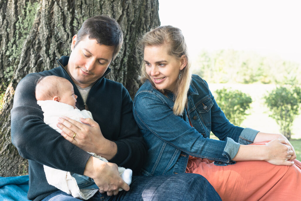 parents outside with baby