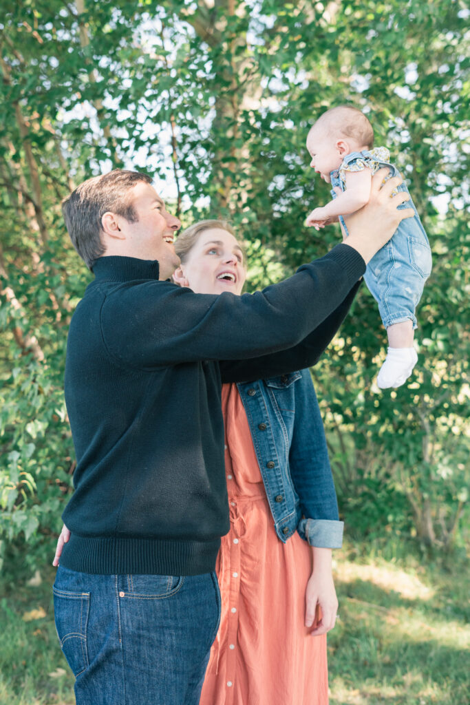 parents holding baby up