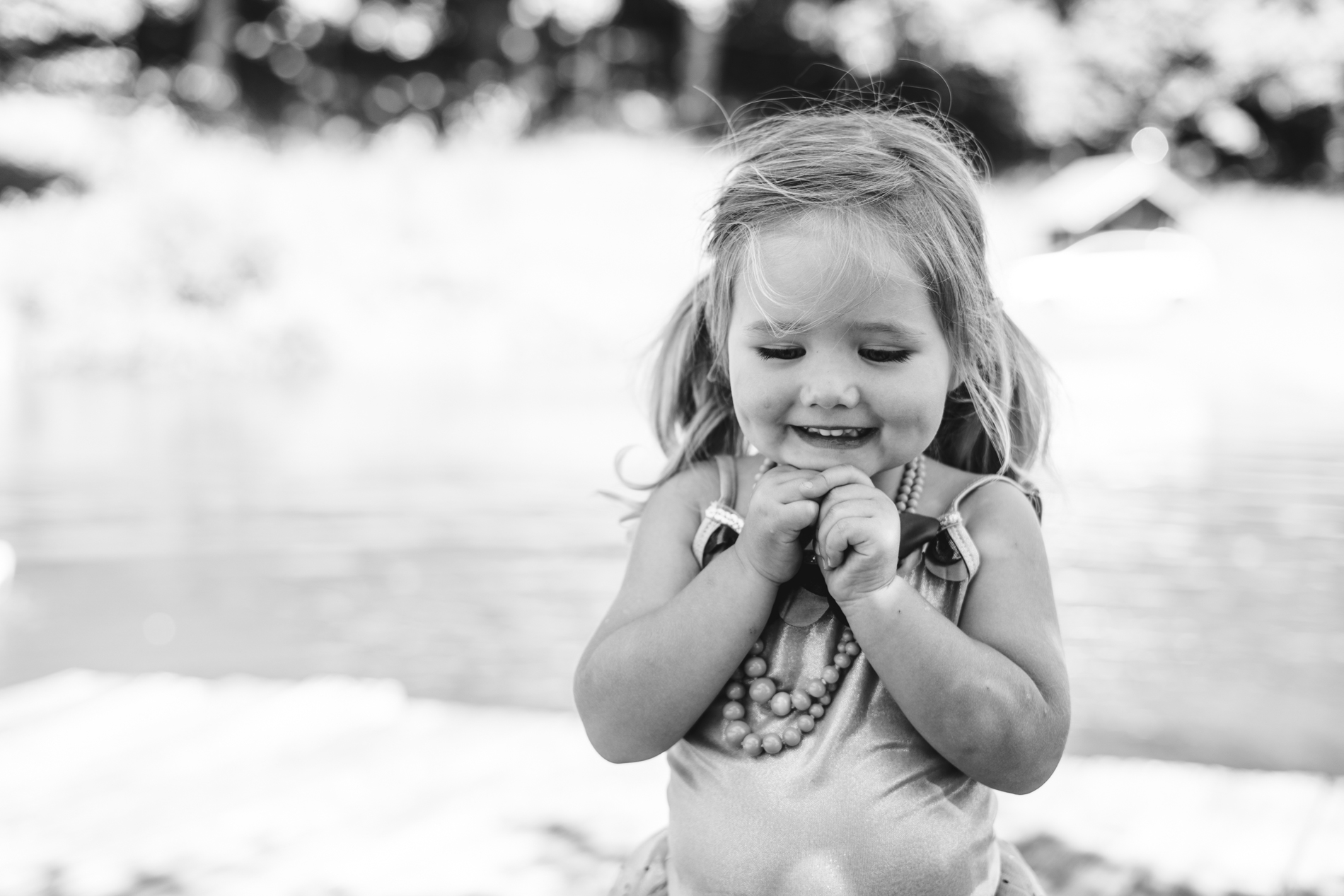 Little girl portrait hands under chin