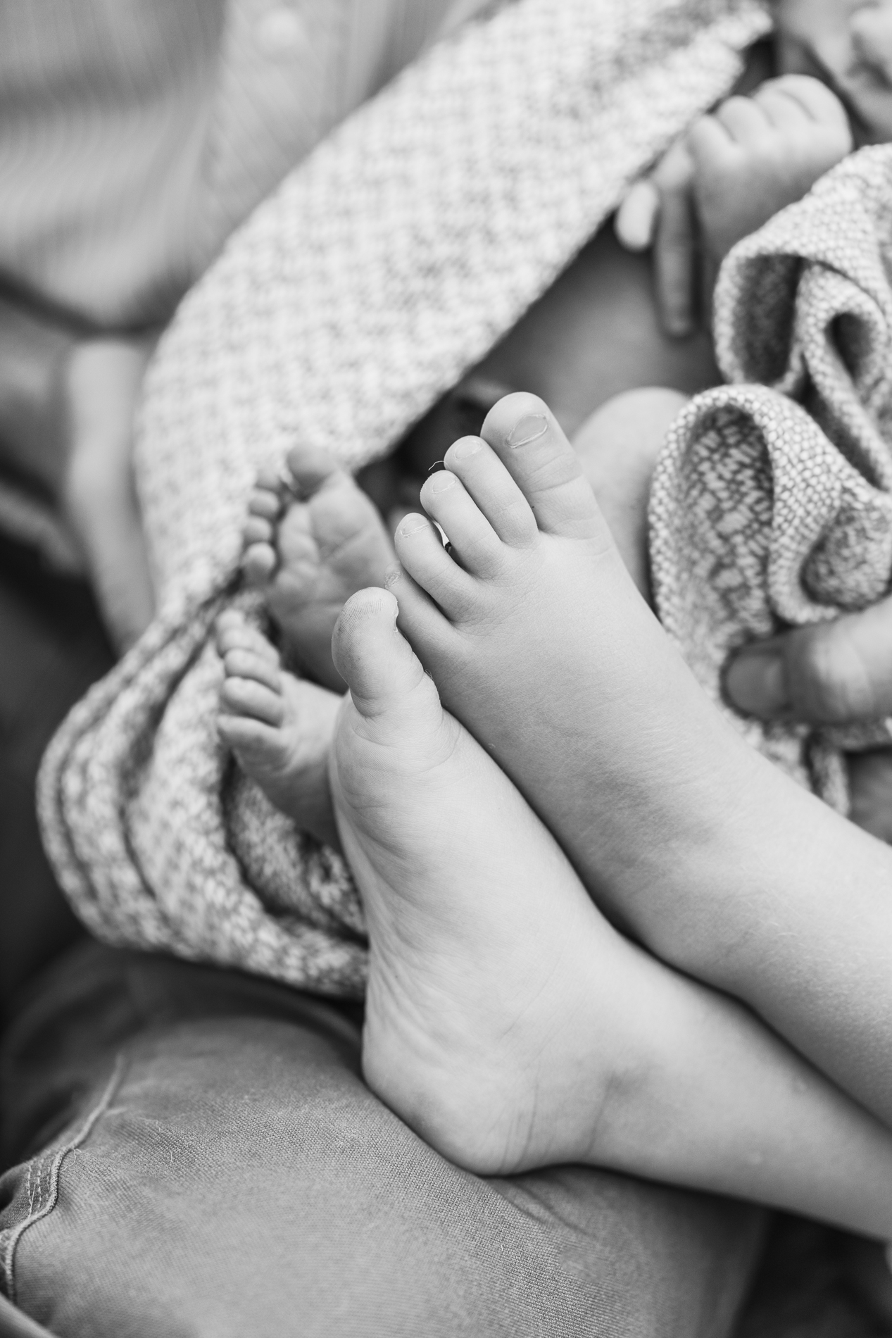children's feet snuggled together