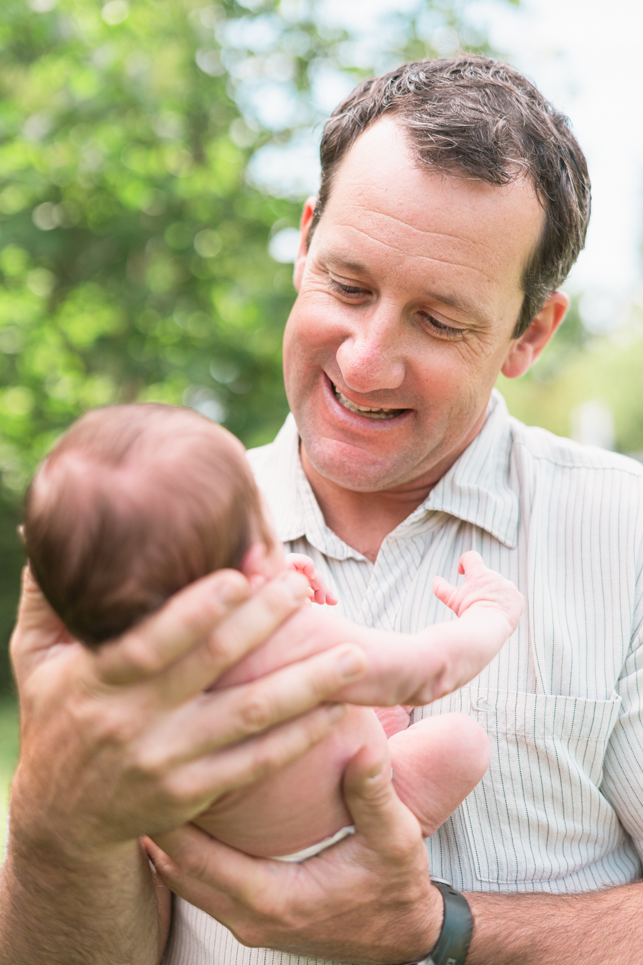 dad admiring baby son