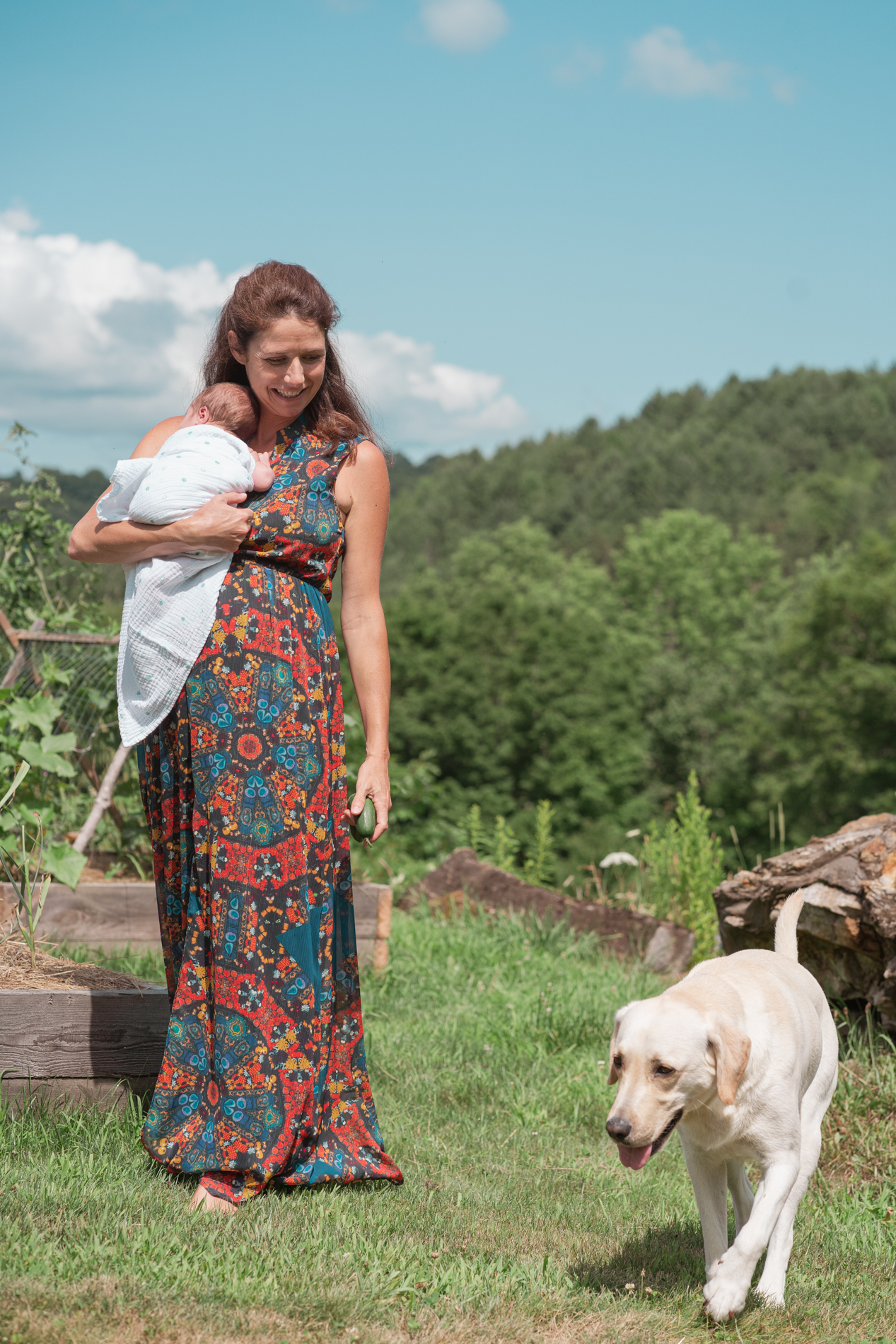 mom walking from garden with dog and cucumber