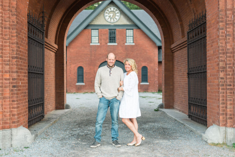 Couple standing during engagement session at shelburne farms