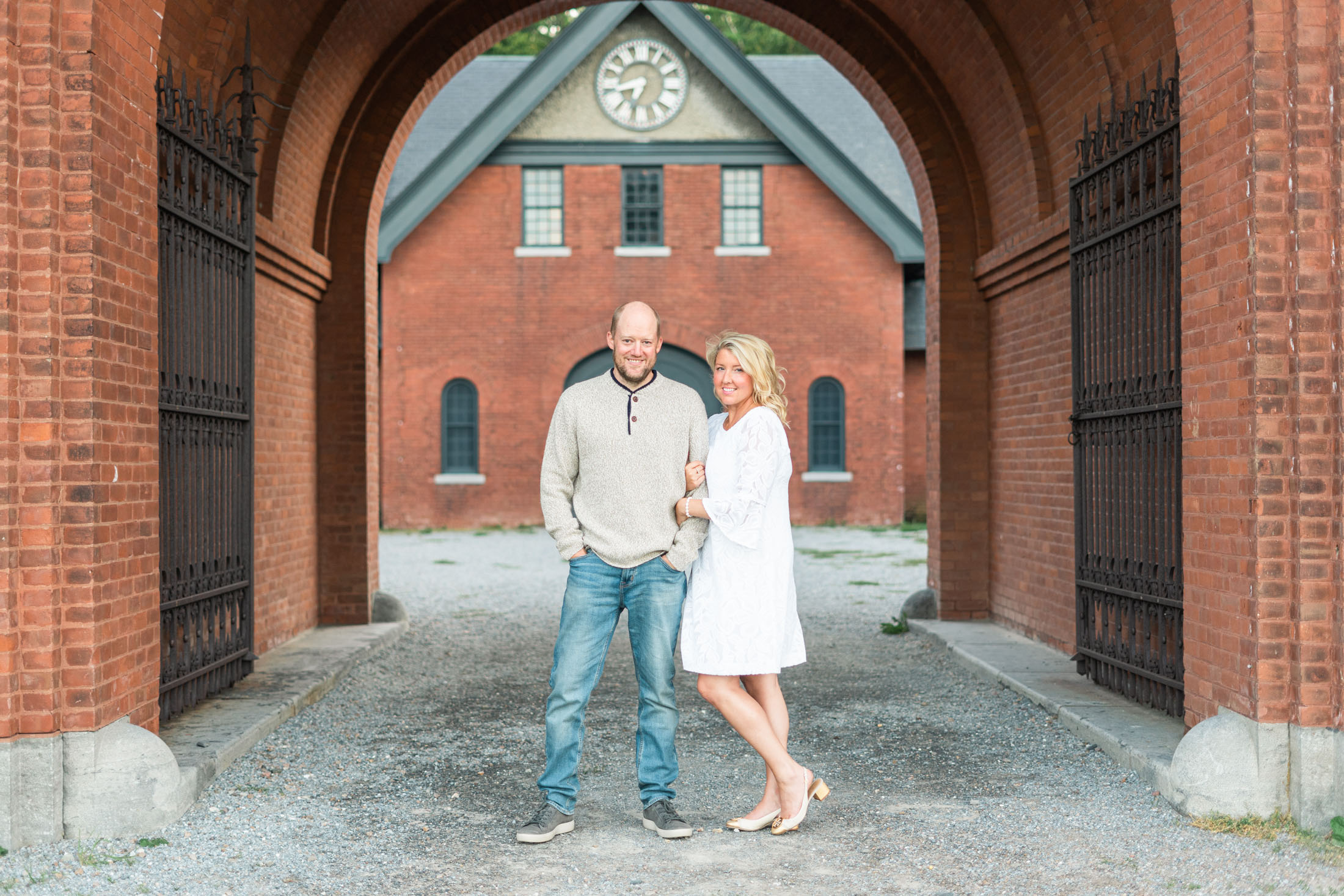 Couple standing during engagement session at shelburne farms