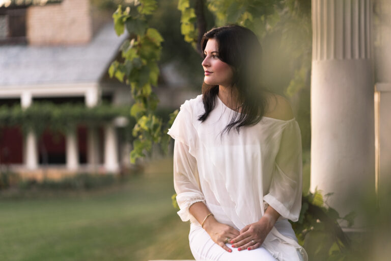 portrait of woman at saint-gaudens in cornish, nh with greek architecture