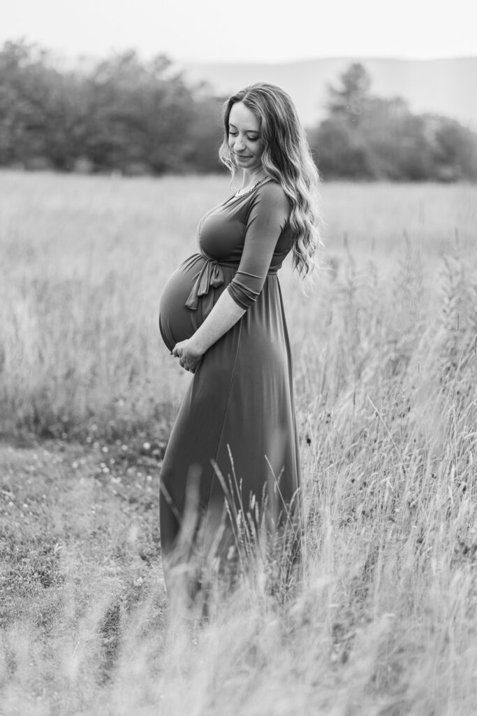 Pregnant woman standing in field