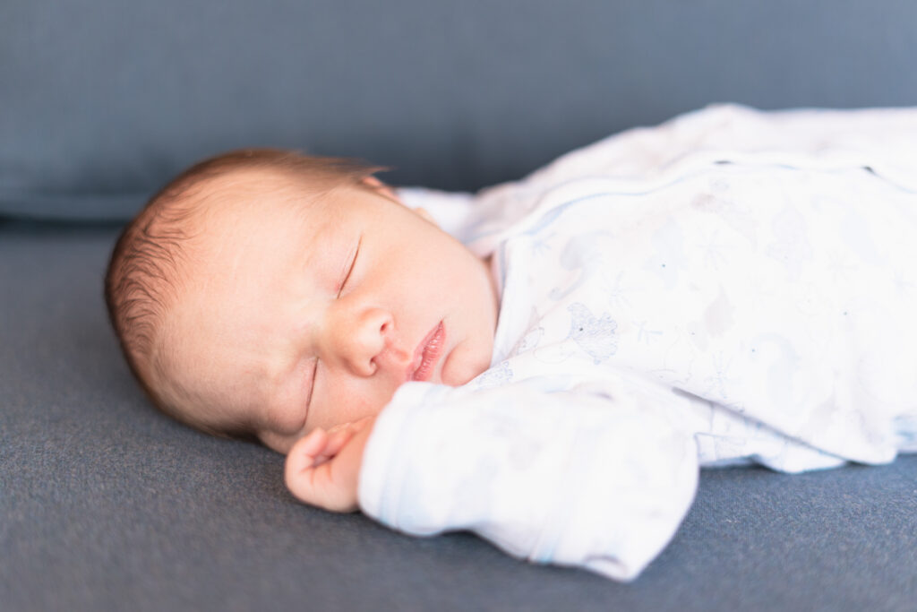 sleeping baby on blue background