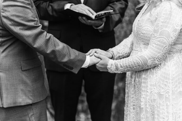 close-up of bride and grooms hands at the ceremony