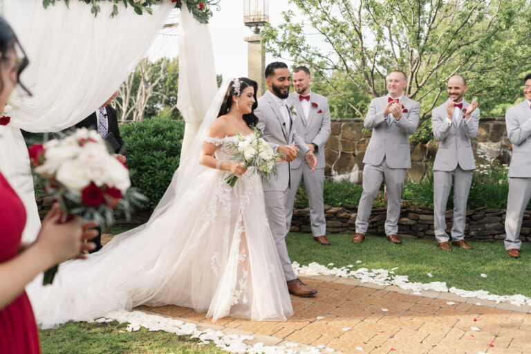 bride and groom walking from the alter after getting married, granite rose weddings, hampstead, nh