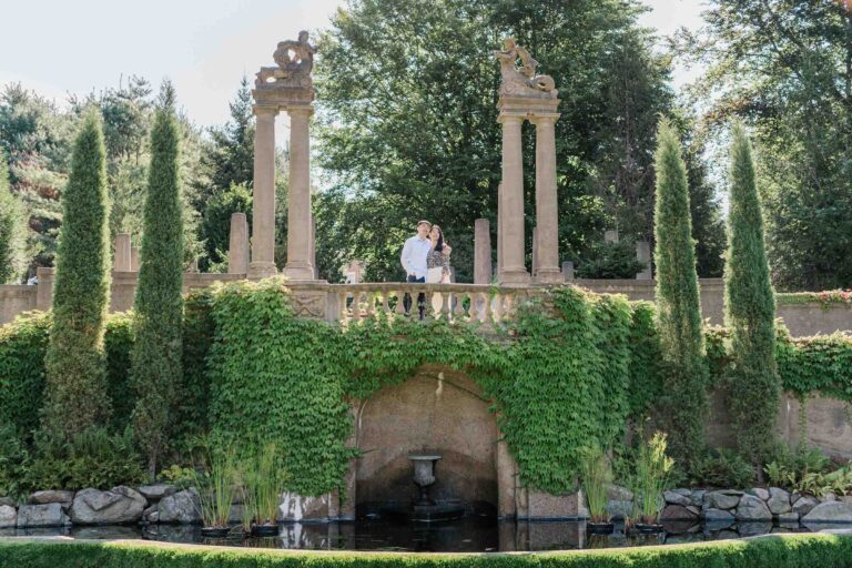 wide shot of architecture and fountain during engagement session at castle hill on the crane estate