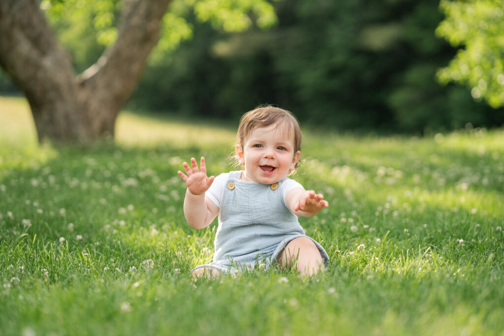 little boy playing in grass at Saint-Gaudens in Cornish, NH