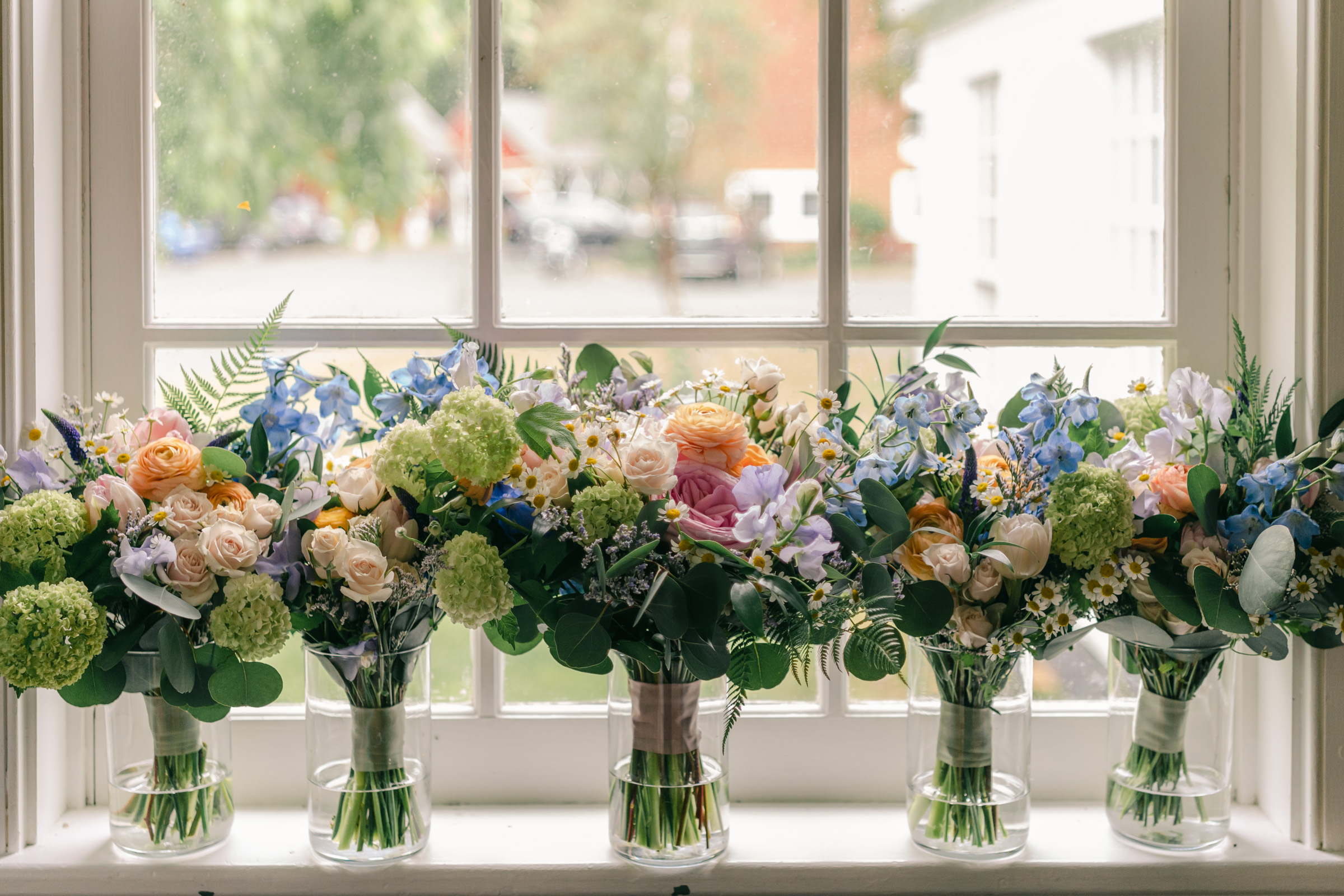 detail photo of floral bouquets in window