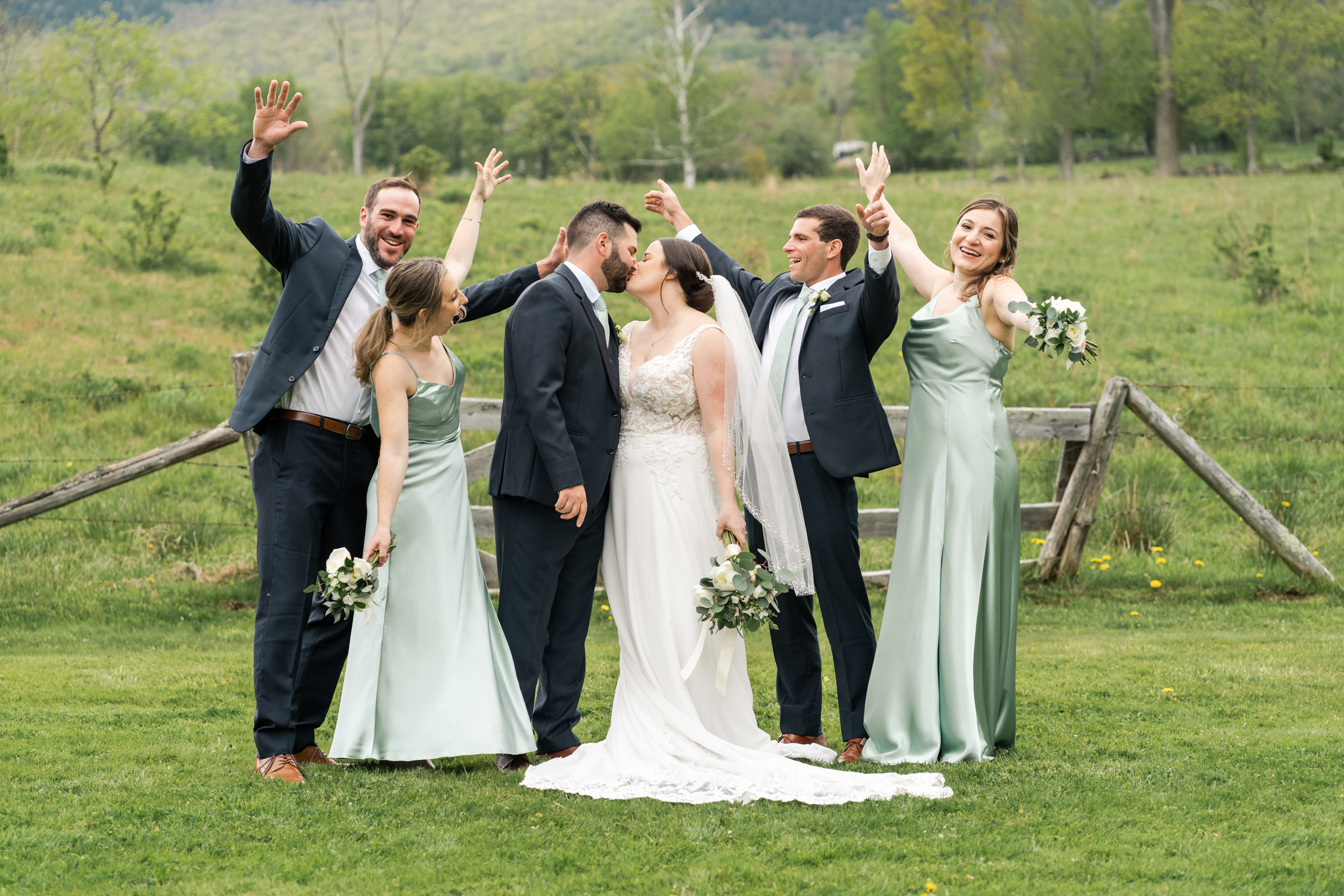 wedding party cheering at round barn farm
