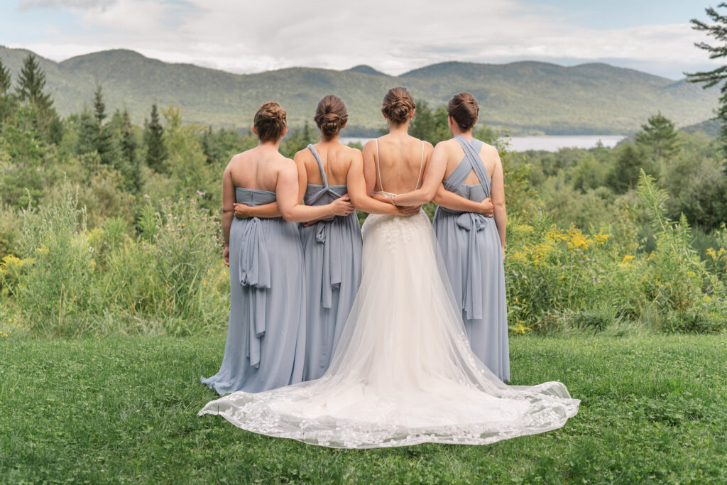 bridesmaids standing and looking out at views at mountain top resort