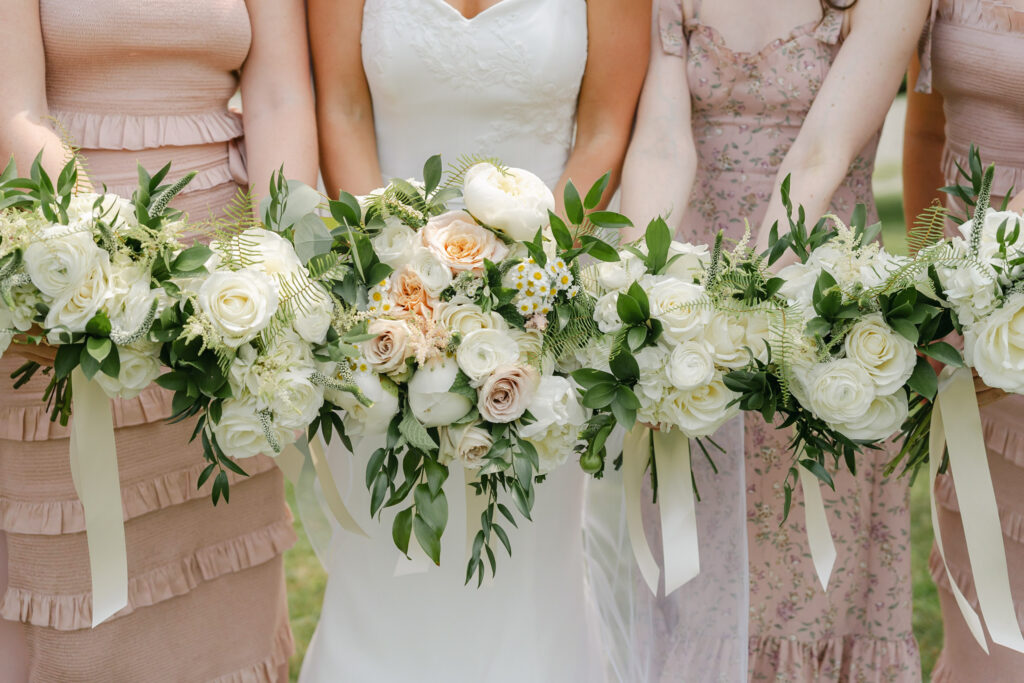 beautiful bouquets held by bridesmaids in pink dresses