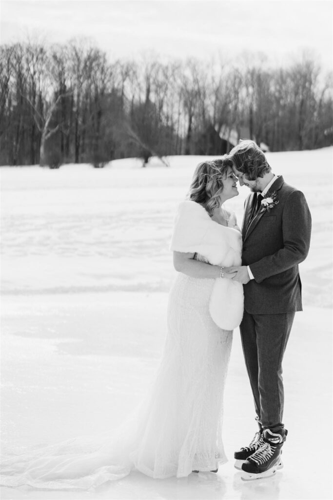 couple forehead to forehead during ice skating first look at mountain top inn, chittenden, vt