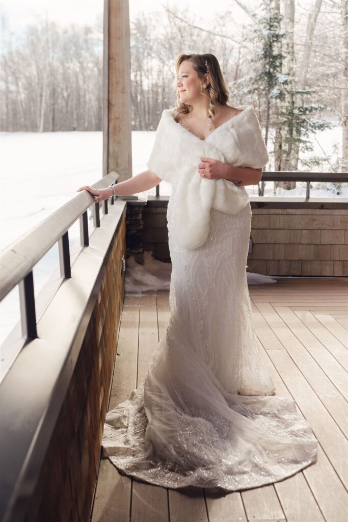 bride in winter wedding dress and stole, at mountain top inn, chittenden, vt