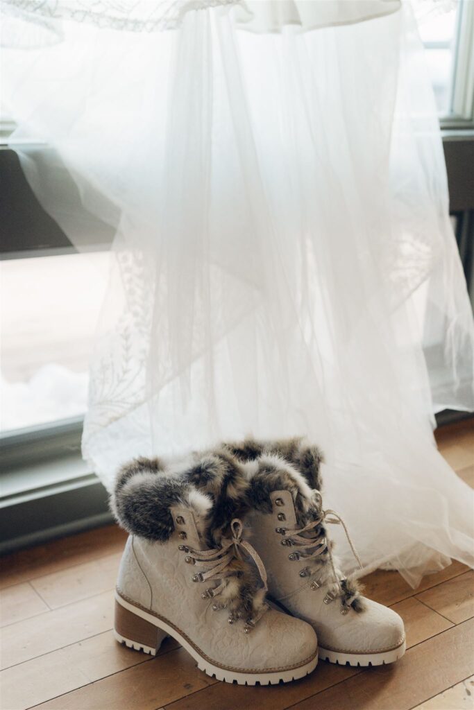 Dress photographed near window with winter boots mountain top inn, chittenden, vt