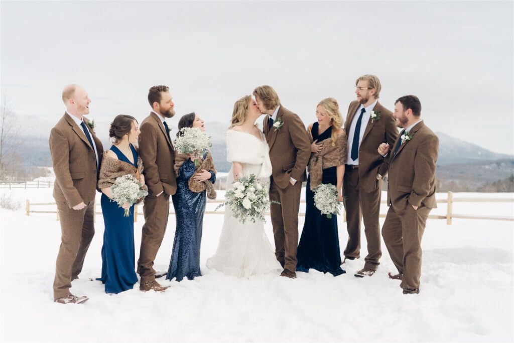 Wedding Party in brown navy with mountains in background at mountain top inn