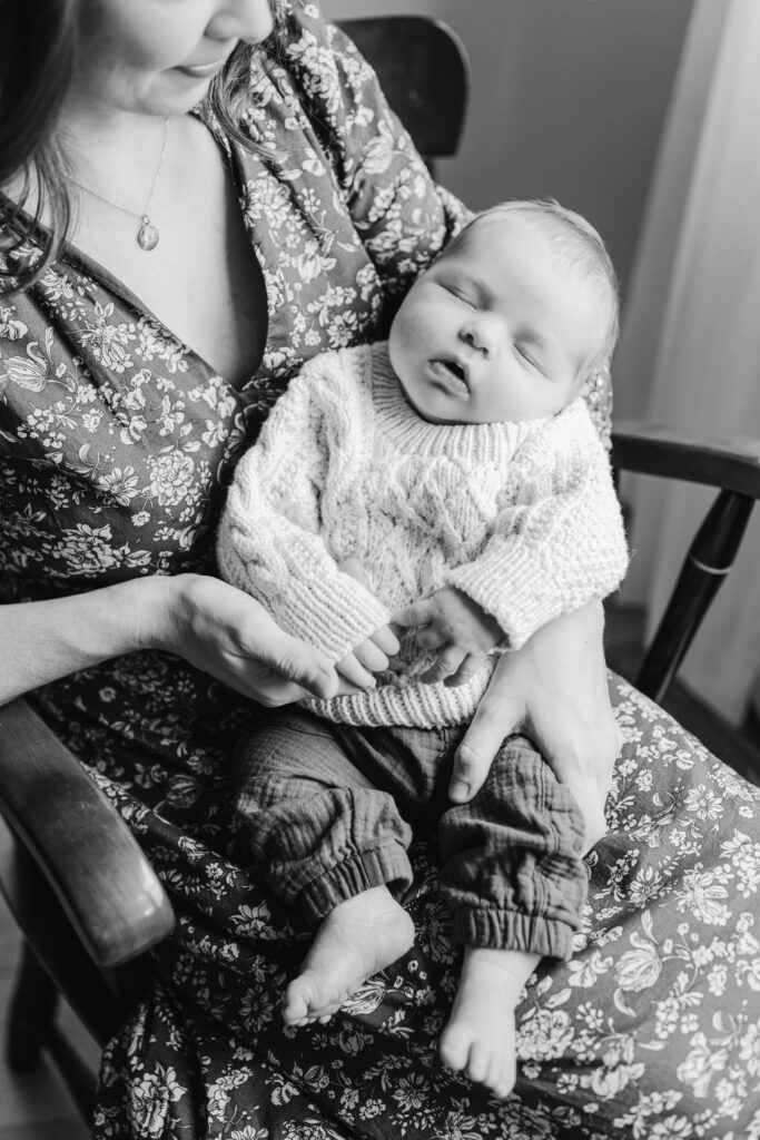 baby in mother's lap in rocking chair