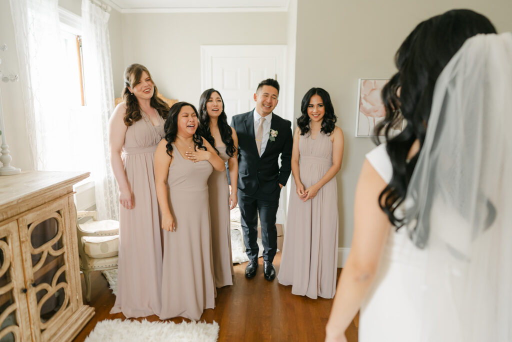 bride sharing first look with attendants at connemara house