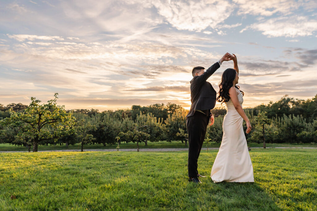 couple dancing in sunset apple orchard at connemara
