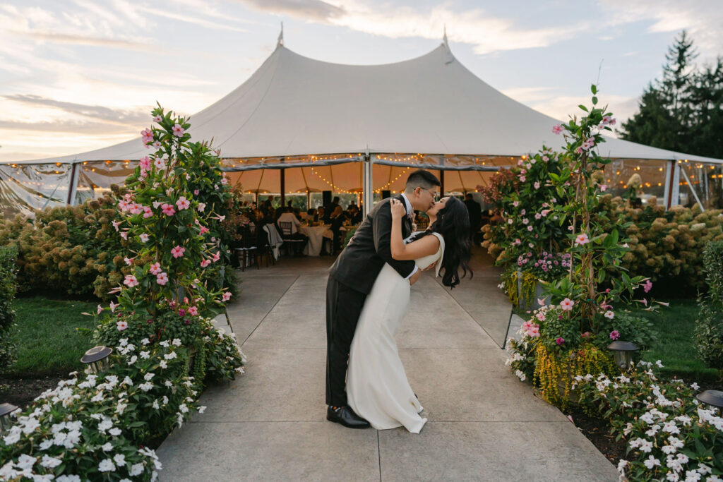 married couple kiss and dip in front of connemara house