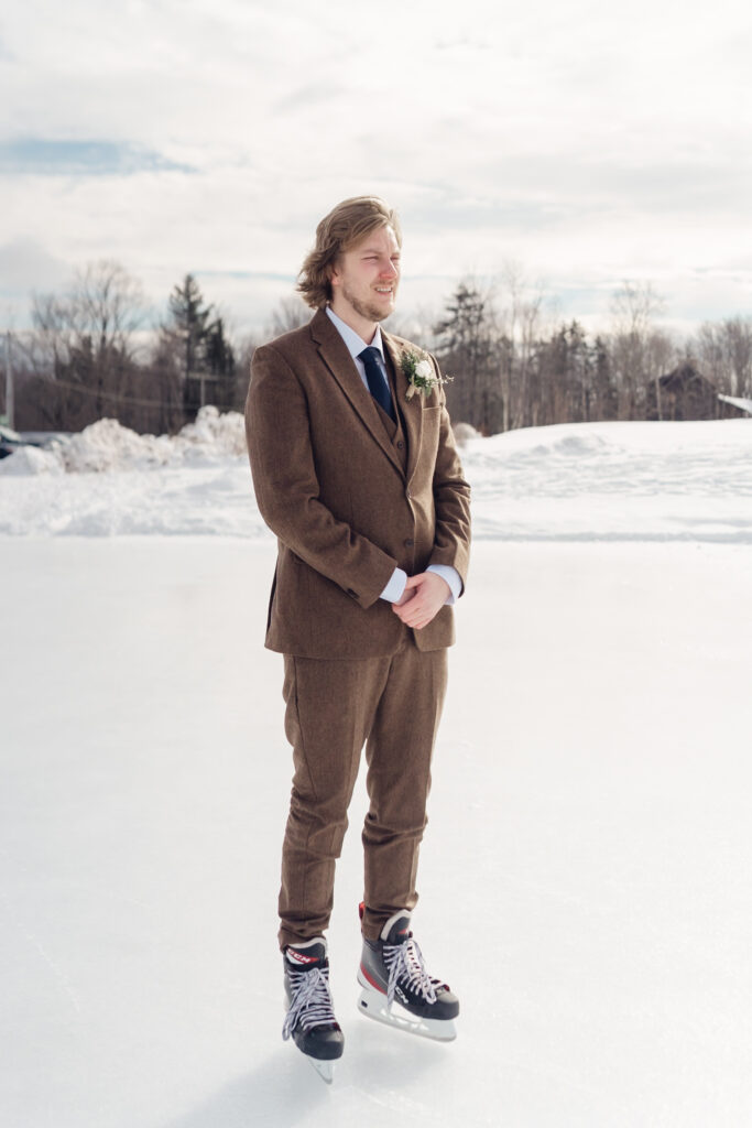 groom waiting for first look on ice ring at mountain top inn, chittenden, vt