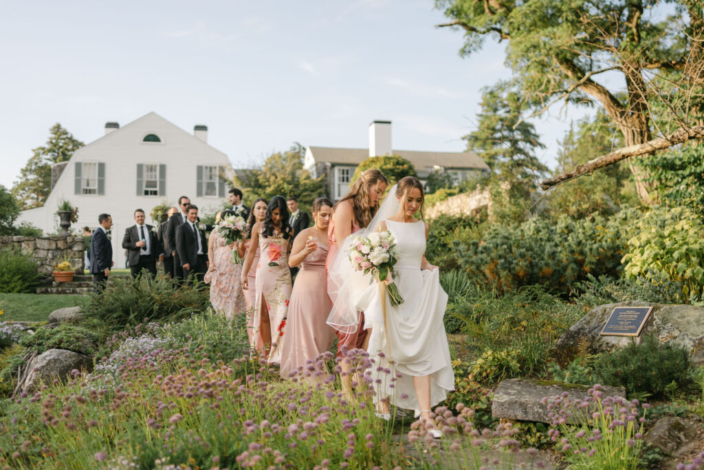 wedding party walking through garden at the fells