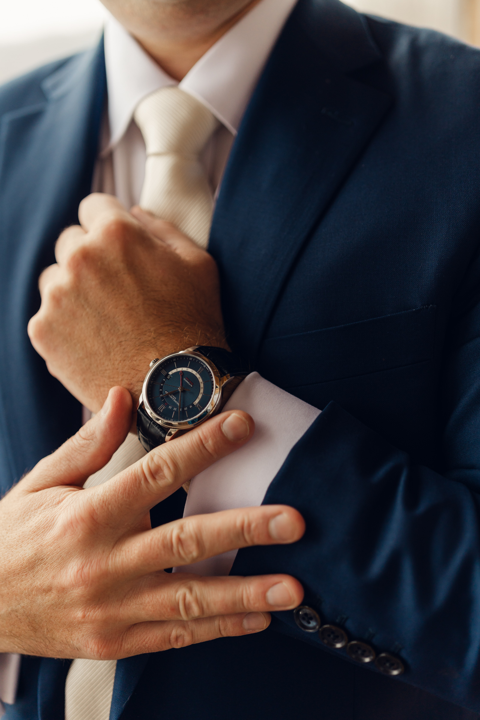 groom showing watch during Vermont Wedding at The Jewel at Mountain Top Inn
