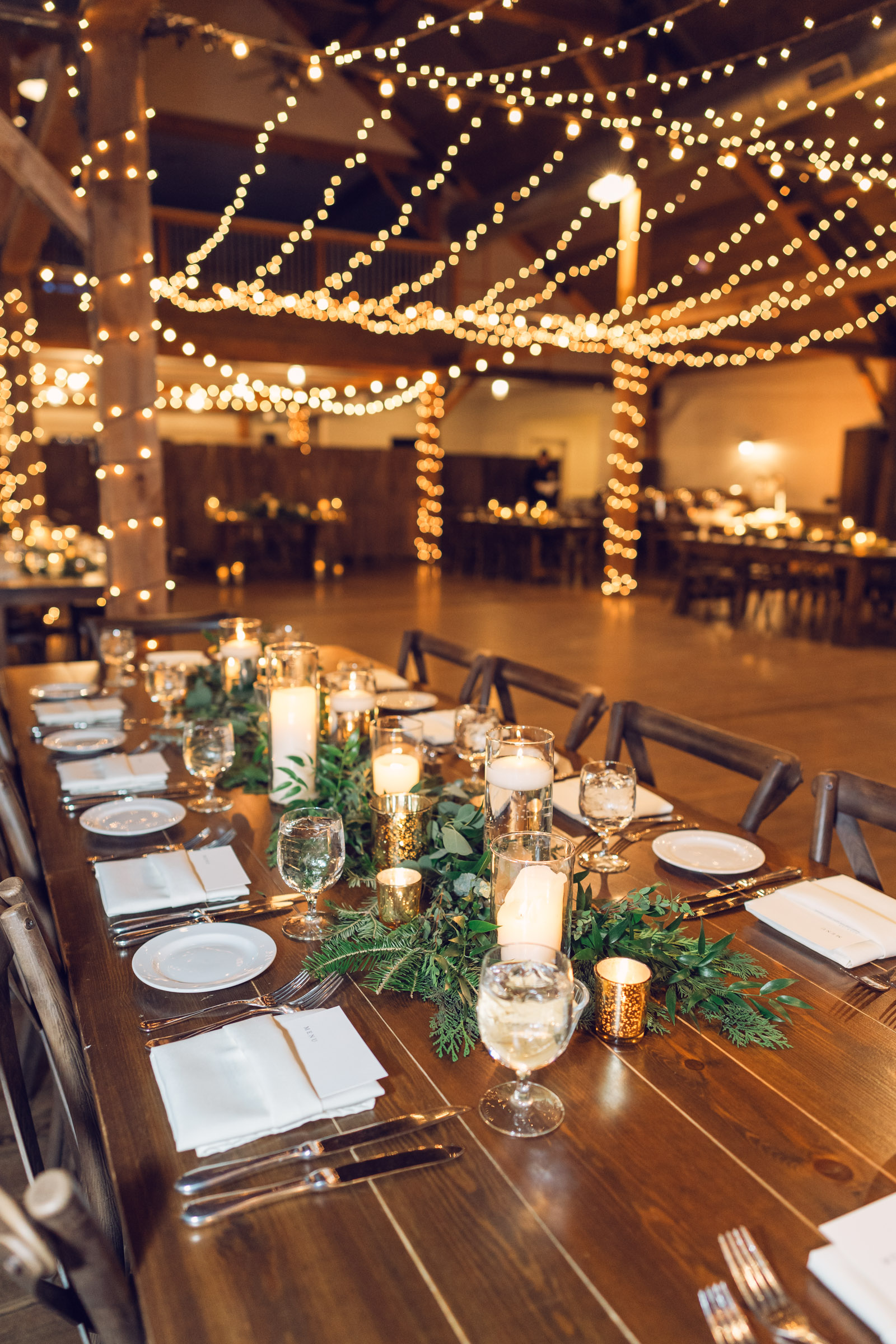 shining gold details on tables during mountain top winter wedding