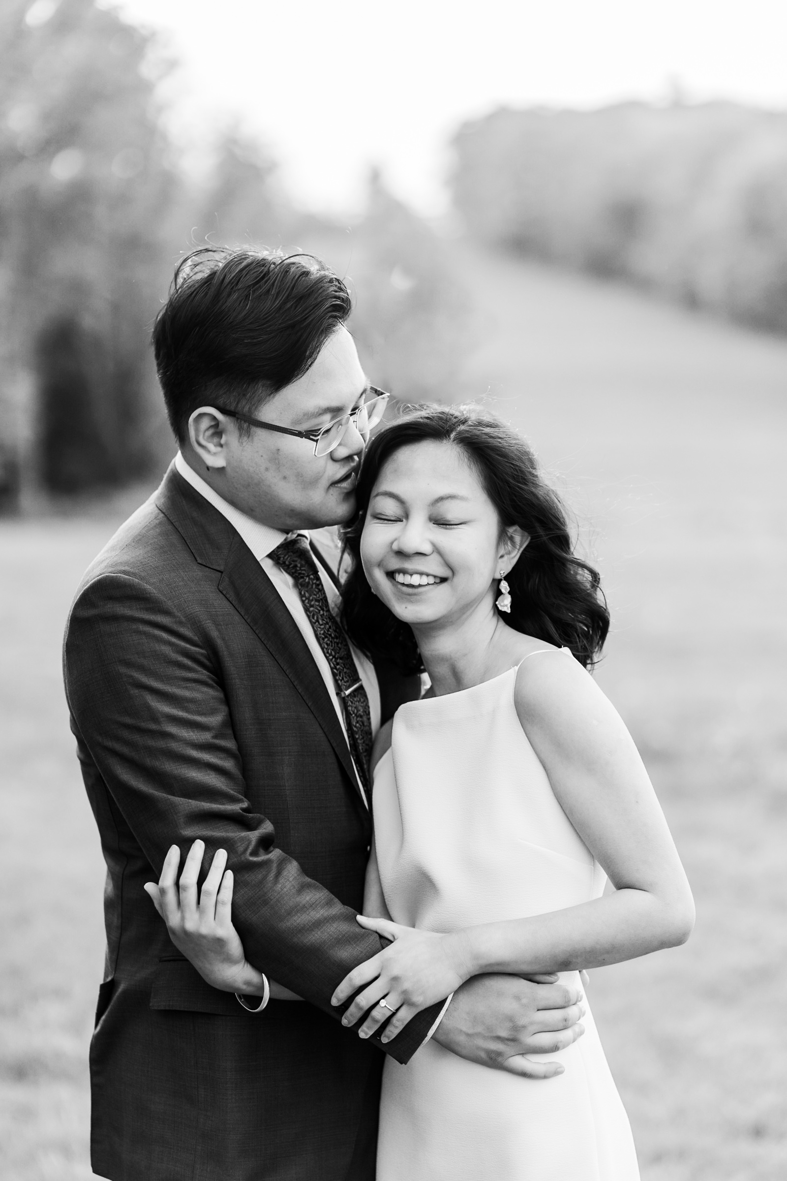 post-wedding portrait session in enfield nh, groom kisses brides head