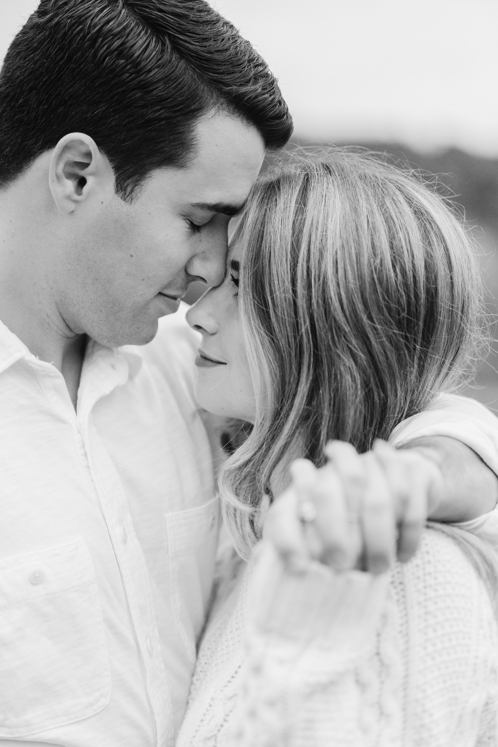 Couple standing foreheads touching vermont engagement session