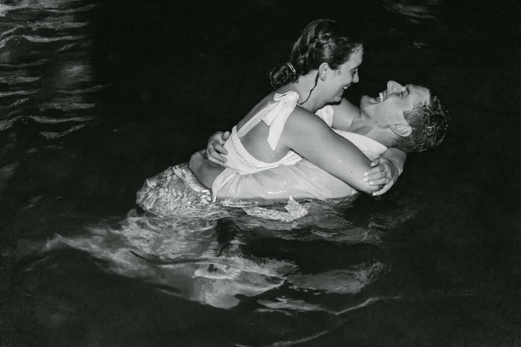 couple in the lake after reception