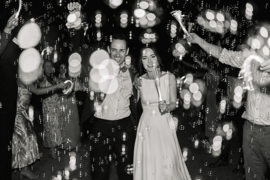 black and white version of sparkler exit with bubbles