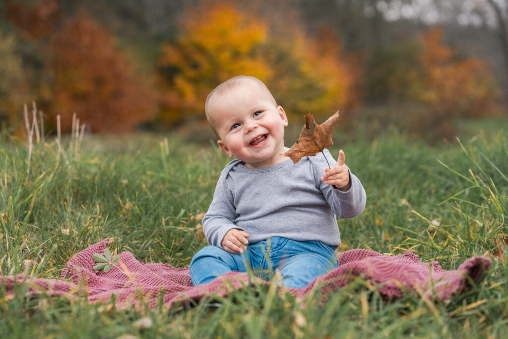 cute baby on blanket in the fall
