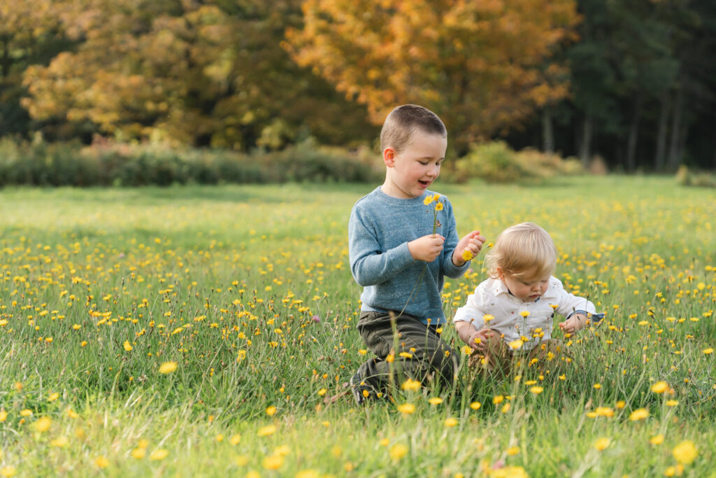 Kids playing in grass at Musterfield Farm