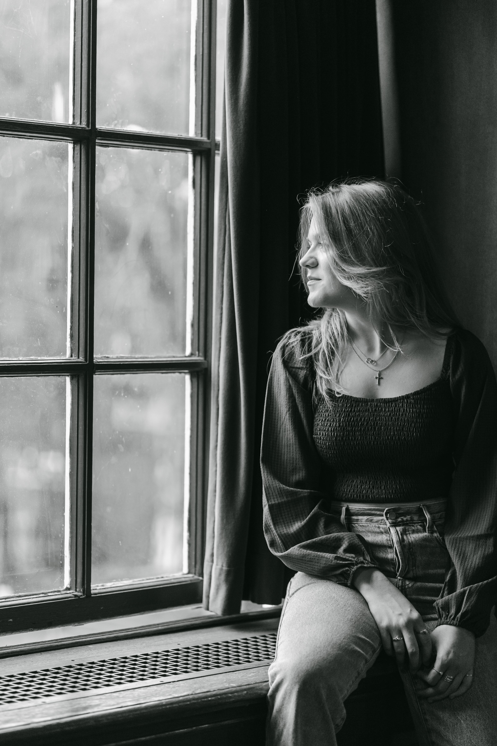 high school senior in window light at dartmouth college