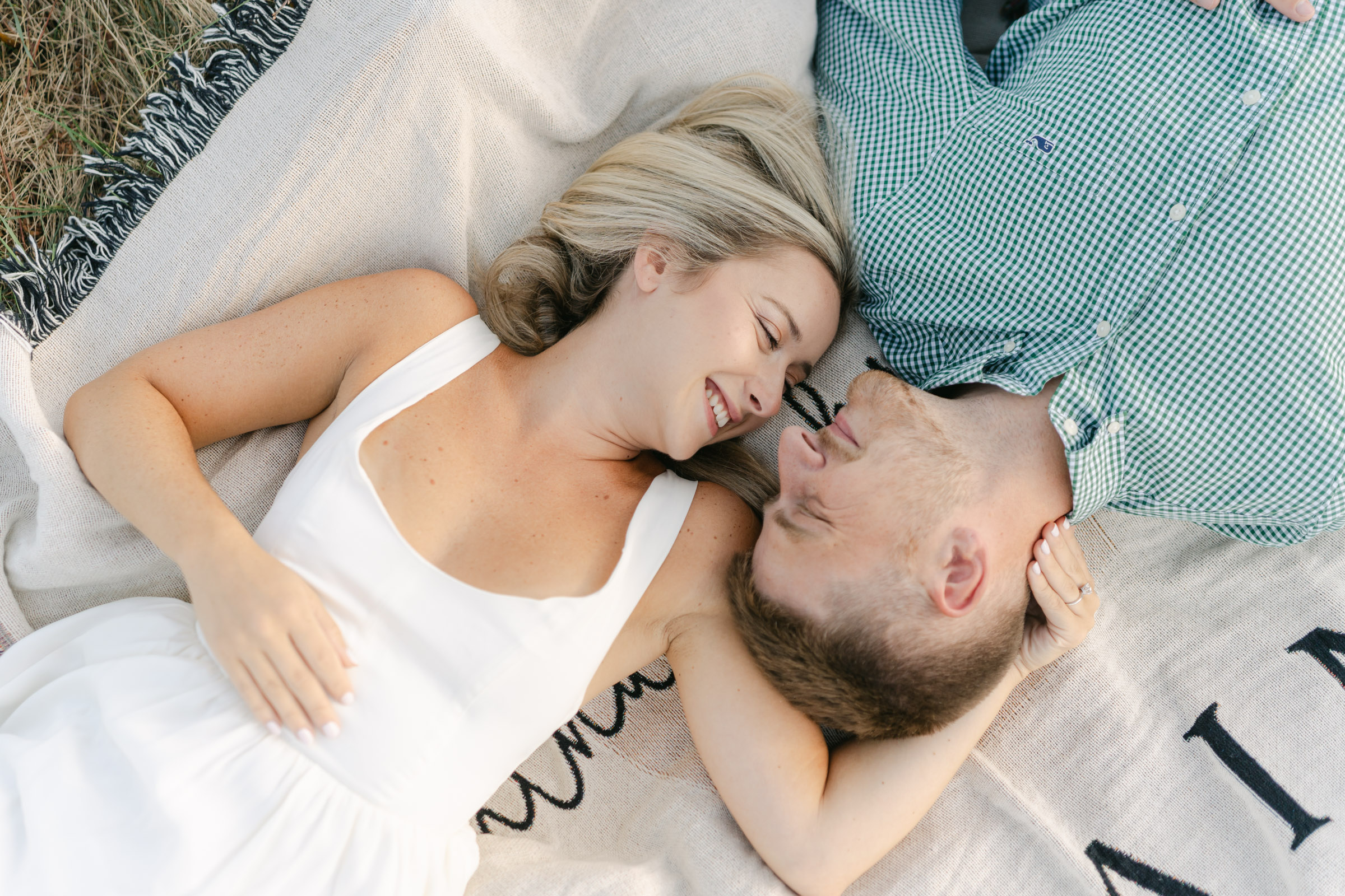 couples snuggling on blanket