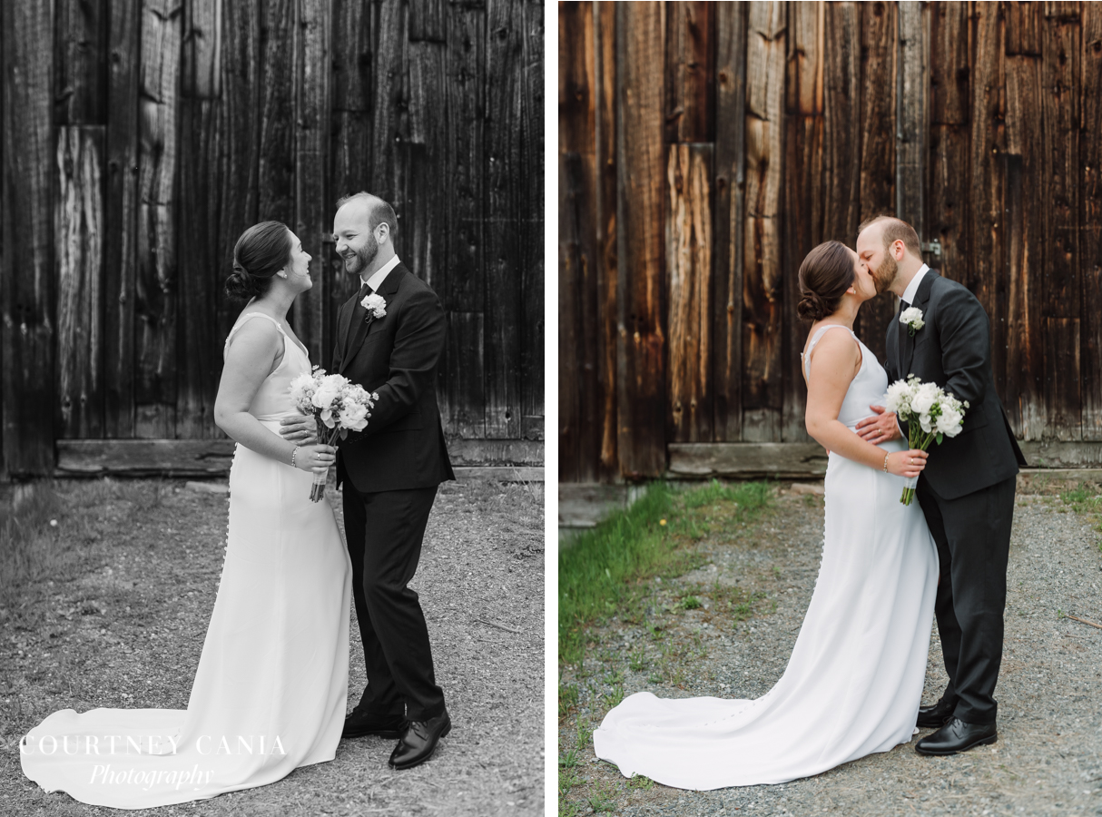 bride and groom pose for portraits in front of wooden barn