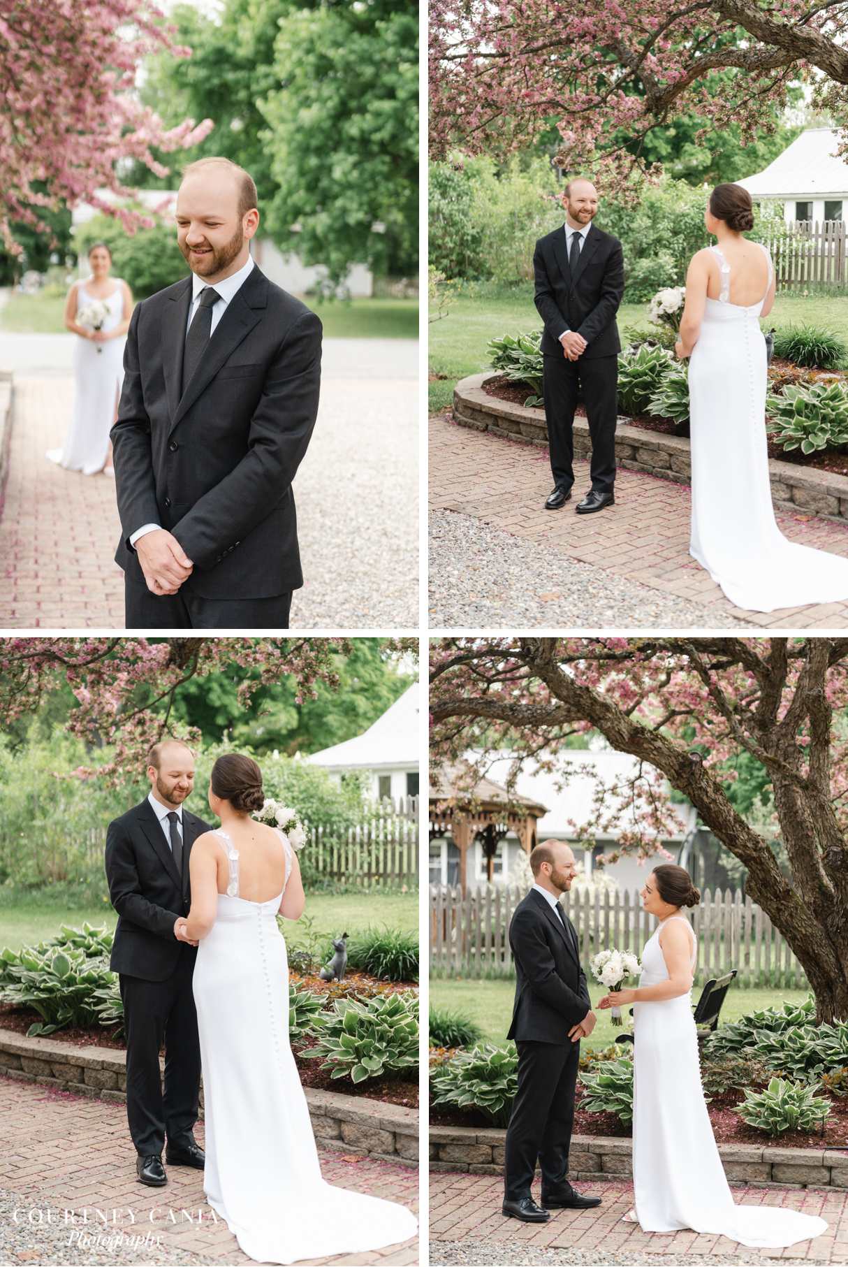 bride and groom have first look under blooming cherry tree