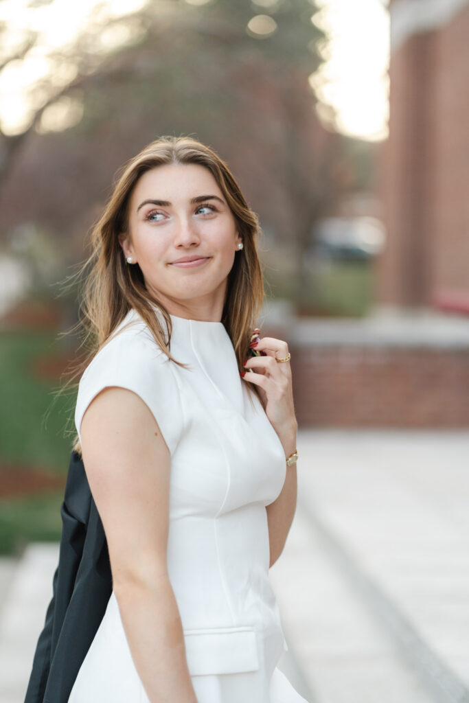 norwich university college grad looking behind and up during photo session, close-up
