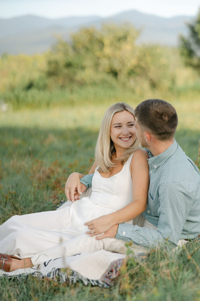 side view of woman looking at man during white mountains engagement session