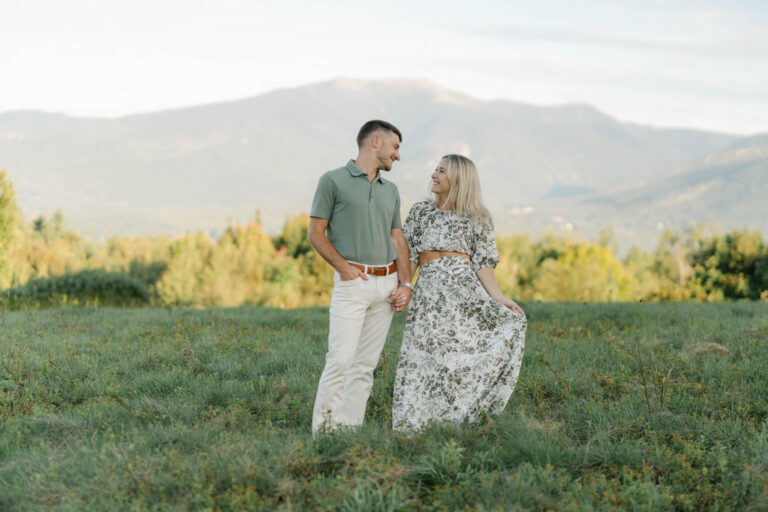 couple looking at eachother sugar hill white mountain engagement session