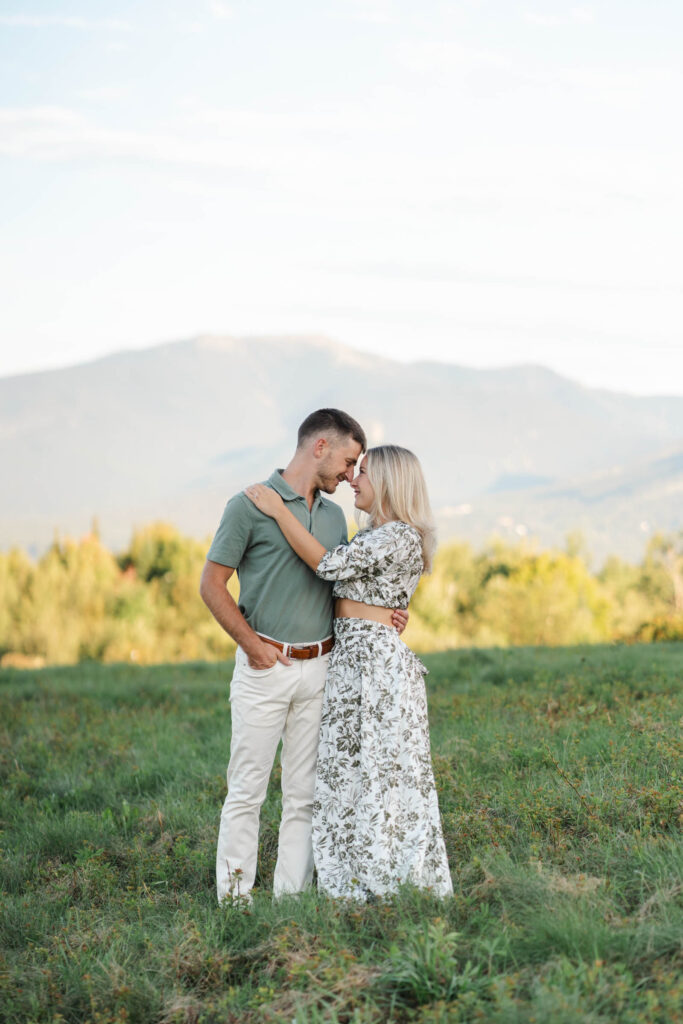 couple stand forhead to forehead sugar hill white mountain engagement session